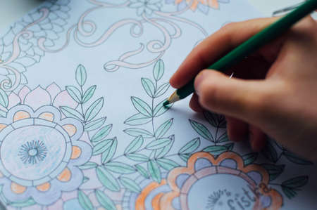 Image of woman coloring, adult coloring book trend, for stress relief. top view. colorer -...