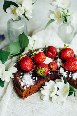 strawberry tart, strawberry shortcake, strawberry jam. serving homemade strawberry cake or pie on wooden rustic table. Strawberry tart on wooden tray, on rustic wooden backgroundの写真素材