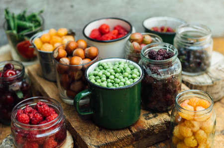 Colorful mix of fruits on black background. View from above. Fresh Organic Berries ,  so you can eat . Various fruitの写真素材
