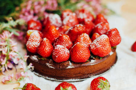 strawberry tart, strawberry shortcake, strawberry jam. serving homemade strawberry cake or pie on wooden rustic table. Strawberry tart on wooden tray, on rustic wooden backgroundの写真素材