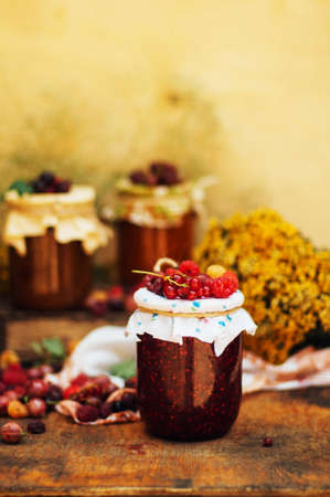 homemade strawberry pits. dessert made of must and flour placed inside small jars. Homemade raspberry jam ready for storage. jar filled with homemade apricot jamの写真素材