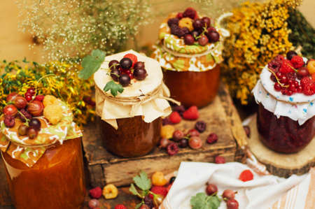 homemade strawberry pits. dessert made of must and flour placed inside small jars. Homemade raspberry jam ready for storage. jar filled with homemade apricot jamの写真素材