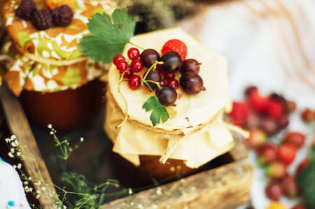 homemade strawberry pits. dessert made of must and flour placed inside small jars. Homemade raspberry jam ready for storage. jar filled with homemade apricot jamの写真素材