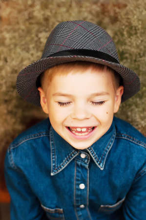 Child's happy face . Portrait of a Cute Kid.  little boy with short blond hair and brown yeas....