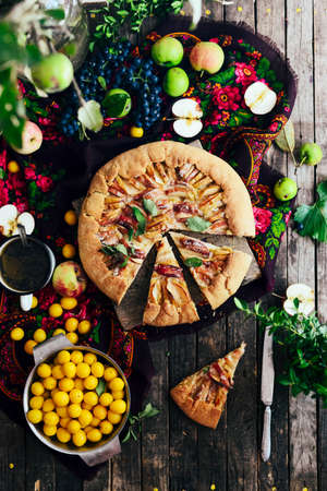 Pie with fruits and marzipan. Pie with fresh pear and apples. a traditional pie filled with jam and fresh fruit, very few ingredients for a classical tart. Homemade apple cakeの写真素材