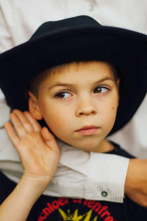 Portrait of a happy mother and her son  outdoor.  Series of a mother and son outdoor portrait in a park. Portrait of young boy holding his mother's arm. In loving arms.Boys his mother's Arms.の写真素材