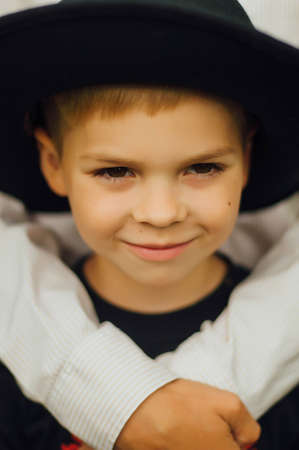 Portrait of a happy mother and her son  outdoor.  Series of a mother and son outdoor portrait in a park. Portrait of young boy holding his mother's arm. In loving arms.Boys his mother's Arms.の写真素材