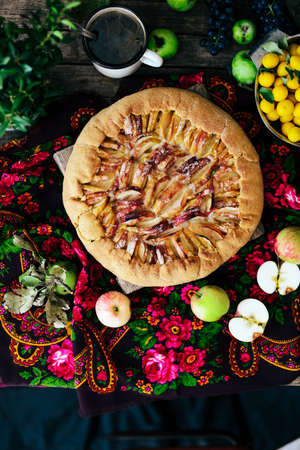 Pie with fruits and marzipan. Pie with fresh pear and apples. a traditional pie filled with jam and fresh fruit, very few ingredients for a classical tart. Homemade apple cakeの写真素材
