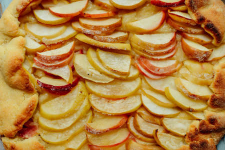 Homemade Organic Apple Pie Dessert Ready to Eat. apple pie on table closeup. Traditional Italian cake with ricotta cheese and sour apples. Top view,  piece of apple pie on a wooden table.の写真素材