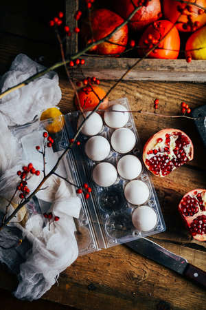 Different fresh citrus fruit in a basket on a  wooden background.  Assorted citrus fruits  on dark vintage background. Agriculture, Gardening. Fresh citrus fruits on rustic wooden background, closeupの写真素材