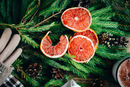 Extensive series of holiday shots with a variety of props and backgrounds. Lots of copyspace for ads. Christmas presents on wooden table. A couple of gifts wrapped in Christmas themed wrapping paper.の写真素材