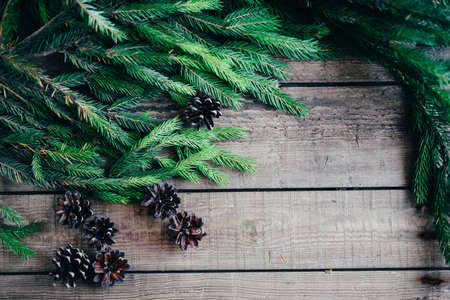 Extensive series of holiday shots with a variety of props and backgrounds. Lots of copyspace for ads. Christmas presents on wooden table. A couple of gifts wrapped in Christmas themed wrapping paper.の写真素材