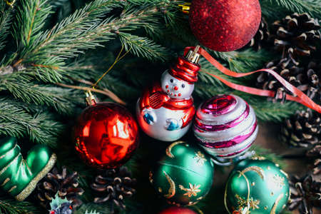 Extensive series of holiday shots with a variety of props and backgrounds. Lots of copyspace for ads. Christmas presents on wooden table. A couple of gifts wrapped in Christmas themed wrapping paper.の写真素材