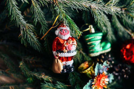 Extensive series of holiday shots with a variety of props and backgrounds. Lots of copyspace for ads. Christmas presents on wooden table. A couple of gifts wrapped in Christmas themed wrapping paper.の写真素材