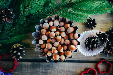 Extensive series of holiday shots with a variety of props and backgrounds. Lots of copyspace for ads. Christmas presents on wooden table. A couple of gifts wrapped in Christmas themed wrapping paper.の写真素材