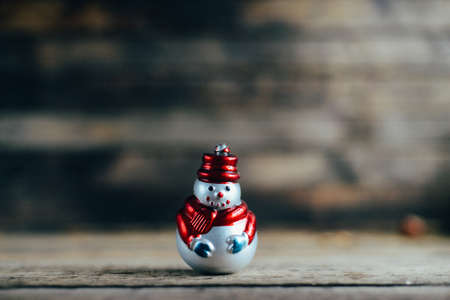 Extensive series of holiday shots with a variety of props and backgrounds. Lots of copyspace for ads. Christmas presents on wooden table. A couple of gifts wrapped in Christmas themed wrapping paper.の写真素材