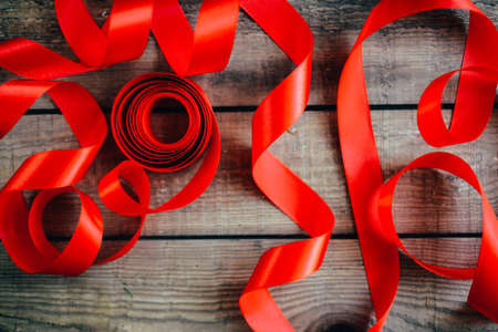 Extensive series of holiday shots with a variety of props and backgrounds. Lots of copyspace for ads. Christmas presents on wooden table. A couple of gifts wrapped in Christmas themed wrapping paper.の写真素材