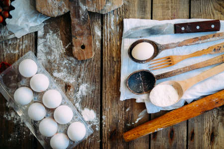 Homemade bakery making, gingerbread cookies close-up.  xmas sweet, winter holidays. Hands roll out gingerbread dough on board. Cookies or pie preparing. Baking ingredients. Christmas New Year conceptの写真素材