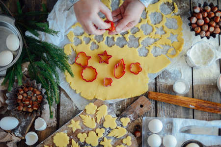 Homemade bakery making, gingerbread cookies close-up.  xmas sweet, winter holidays. Hands roll out gingerbread dough on board. Cookies or pie preparing. Baking ingredients. Christmas New Year conceptの写真素材