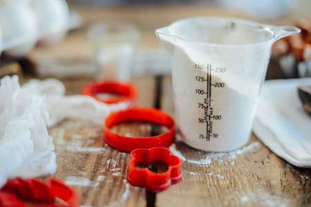 Homemade bakery making, gingerbread cookies close-up.  xmas sweet, winter holidays. Hands roll out gingerbread dough on board. Cookies or pie preparing. Baking ingredients. Christmas New Year conceptの写真素材
