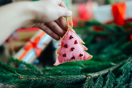 Extensive series of holiday shots with a variety of props and backgrounds. Lots of copyspace for ads. Christmas presents on wooden table. A couple of gifts wrapped in Christmas themed wrapping paper.の写真素材