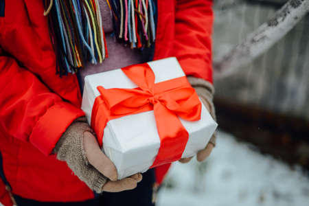 Extensive series of holiday shots with a variety of props and backgrounds. Lots of copyspace for ads. Christmas presents on wooden table. A couple of gifts wrapped in Christmas themed wrapping paper.の写真素材