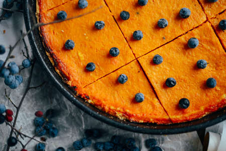 Pumpkin pie with autumn decorations on vintage wooden table.  Pumpkin pie, tart made for Thanksgiving day.  pumpkin pie with  cinnamon on rustic backgroundの写真素材