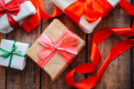 Valentine's Day concept. Gift with red bow  on the wooden background, Valentines. Valentines gift...