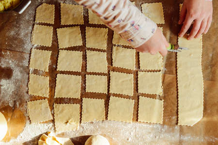 Making of pierogi with potato Vareniki. Russian food . Rustic style. Vareniki dumplings, pierogi before boiling traditional Ukrainian food. Dumpling recipe.の写真素材