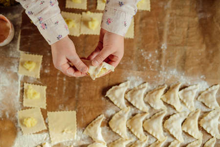 Making of pierogi with potato Vareniki. Russian food . Rustic style. Vareniki dumplings, pierogi before boiling traditional Ukrainian food. Dumpling recipe.の写真素材