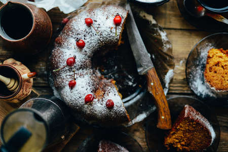 Sliced chocolate pie with mint and ingredients on table. Chocolate pie on a creative plate for your design. Cookie cake with melted chocolate.  homemade banoffee pie chocolateの写真素材
