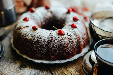 Sliced chocolate pie with mint and ingredients on table. Chocolate pie on a creative plate for your design. Cookie cake with melted chocolate.  homemade banoffee pie chocolateの写真素材