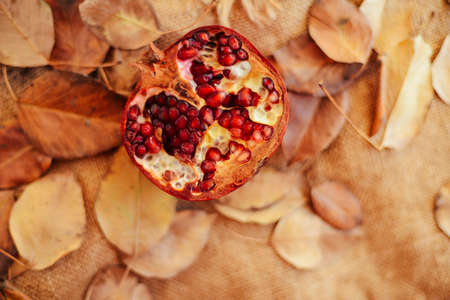 Red juice pomegranate on dark background Red juice pomegranate on dark backgroundの写真素材