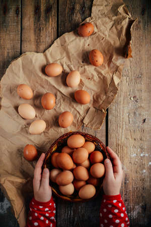 Close up of  eggs in a basket. top view of eggs in bowl. Brown eggs in wooden  bowl.Chicken Egg.  Hen eggs baskeの写真素材