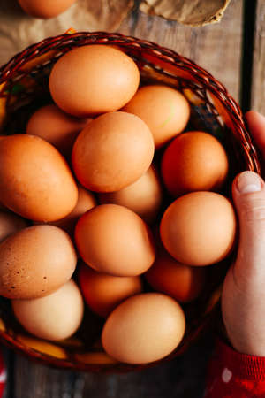 Close up of  eggs in a basket. top view of eggs in bowl. Brown eggs in wooden  bowl.Chicken Egg.  Hen eggs baskeの写真素材