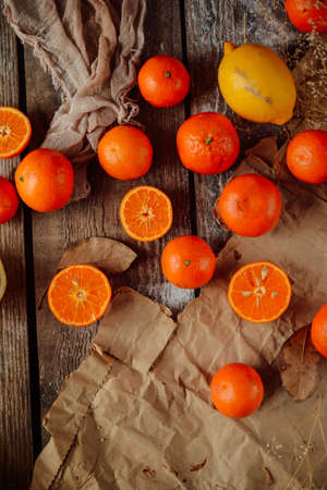Basket of Tangerines on a wooden table.  Delicious and beautiful Tangerines.  Citrus background.  Mandarins Tangerine Closeup. Rustic styleの写真素材