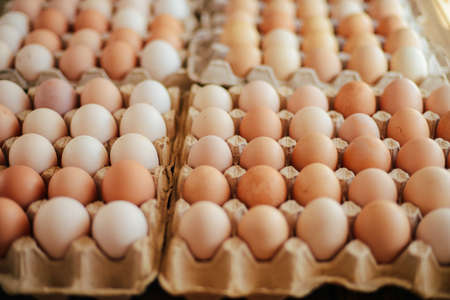Close up of  eggs in a basket. top view of eggs in bowl. Brown eggs in wooden  bowl.Chicken Egg.  Hen eggs baskeの写真素材