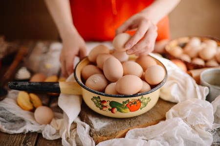 Close up of  eggs in a basket. top view of eggs in bowl. Brown eggs in wooden  bowl.Chicken Egg.