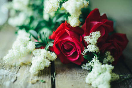 Red roses on wooden vintage table with copy spaceの写真素材