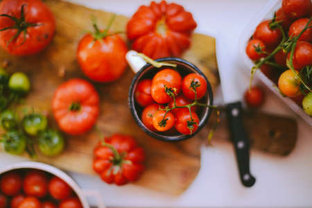 Fresh cherry tomatoes on rustic wooden table, Top view with copy space. の写真素材