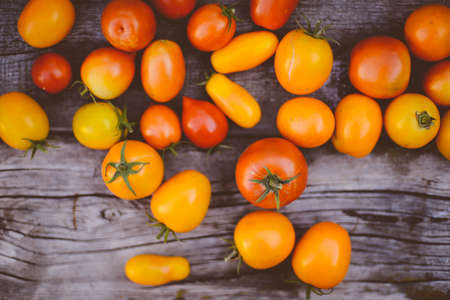 Close-up of fresh, ripe tomatoes on wood backgroundの写真素材