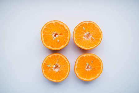 Sliced orange fruit segments isolated on white backgroundの写真素材
