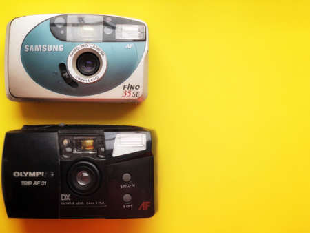 UKRAINE, KYIV - MARCH 28, 2018: Flat lay vintage camera on pastel backgroundのeditorial素材
