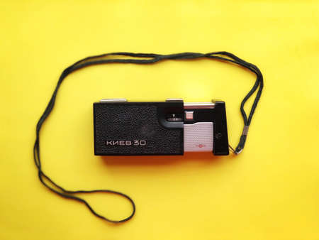 UKRAINE, KYIV - MARCH 28, 2018: Flat lay vintage camera on pastel backgroundのeditorial素材