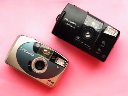 UKRAINE, KYIV - MARCH 28, 2018: Flat lay vintage camera on pastel backgroundのeditorial素材