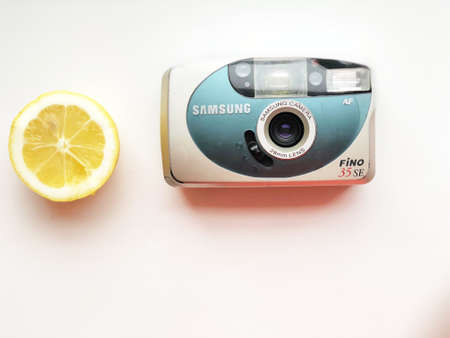 UKRAINE, KYIV - MARCH 28, 2018: Flat lay vintage camera on pastel backgroundのeditorial素材