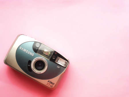 UKRAINE, KYIV - MARCH 28, 2018: Flat lay vintage camera on pastel backgroundのeditorial素材