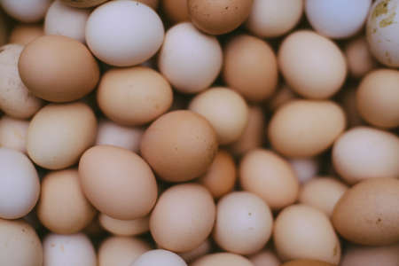many fresh brown eggs for sale at a marketの写真素材