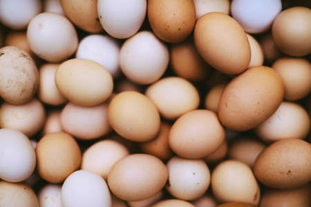 many fresh brown eggs for sale at a marketの写真素材