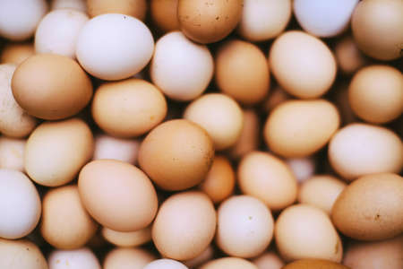 many fresh brown eggs for sale at a marketの写真素材